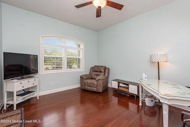 sitting room featuring dark hardwood / wood-style floors and ceiling fan