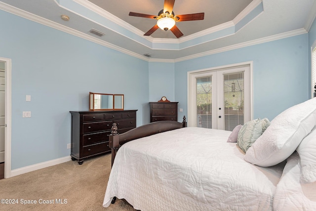 bedroom featuring light carpet, a raised ceiling, crown molding, ceiling fan, and access to exterior