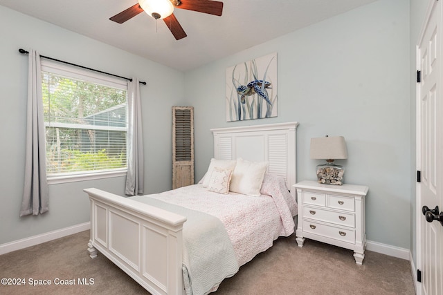 carpeted bedroom featuring ceiling fan