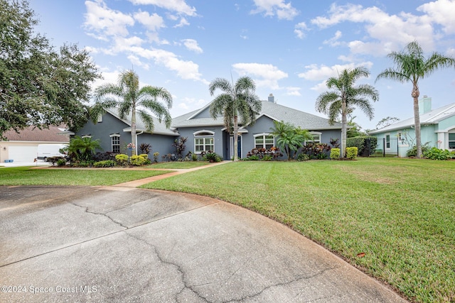 ranch-style house featuring a front yard