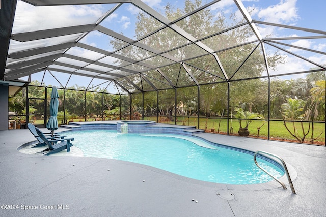 view of swimming pool with an in ground hot tub, glass enclosure, and a patio area