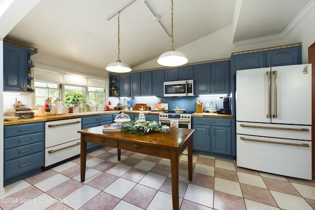 kitchen featuring appliances with stainless steel finishes, ornamental molding, vaulted ceiling, blue cabinetry, and hanging light fixtures