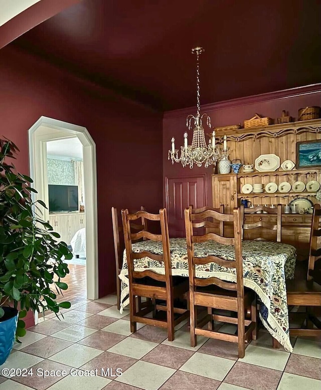 dining space featuring a notable chandelier