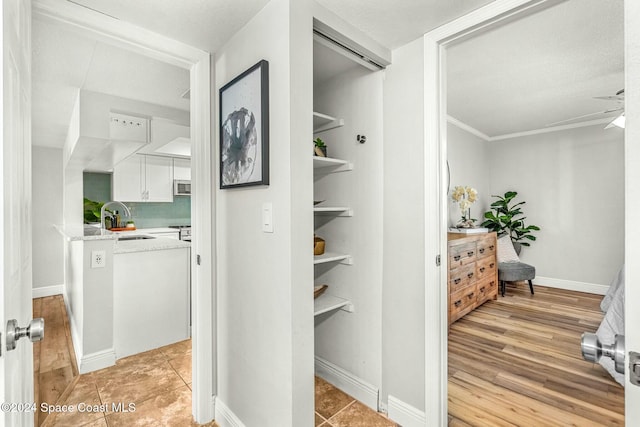 interior space with light hardwood / wood-style flooring and sink