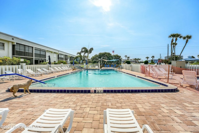 view of swimming pool featuring a patio