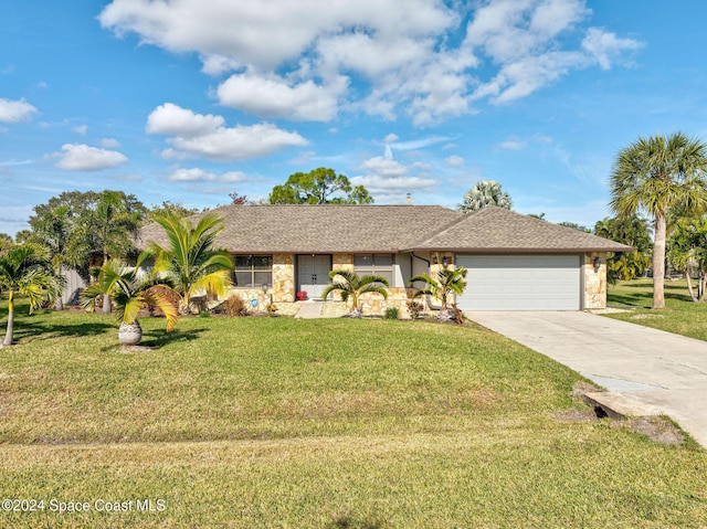 ranch-style home with a garage and a front yard