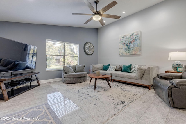 living room with ceiling fan and vaulted ceiling