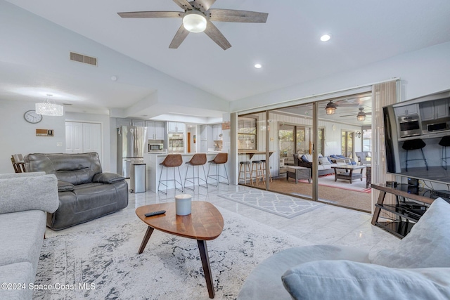 living room with vaulted ceiling and ceiling fan