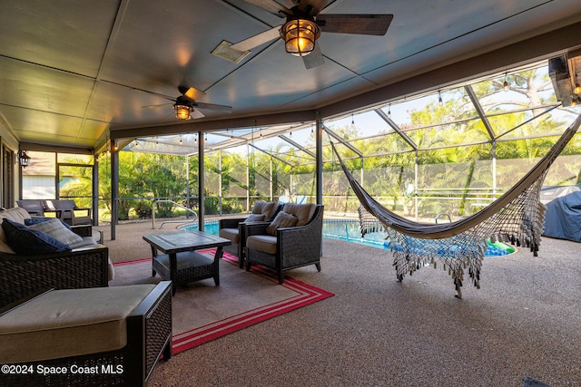 view of patio / terrace featuring glass enclosure and an outdoor hangout area