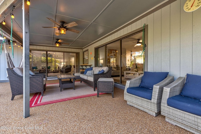 sunroom featuring ceiling fan