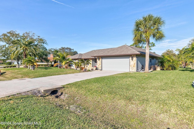 view of front of house featuring a garage and a front lawn