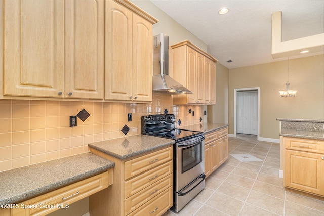 kitchen with light brown cabinetry, stainless steel electric stove, wall chimney range hood, a chandelier, and light tile patterned flooring