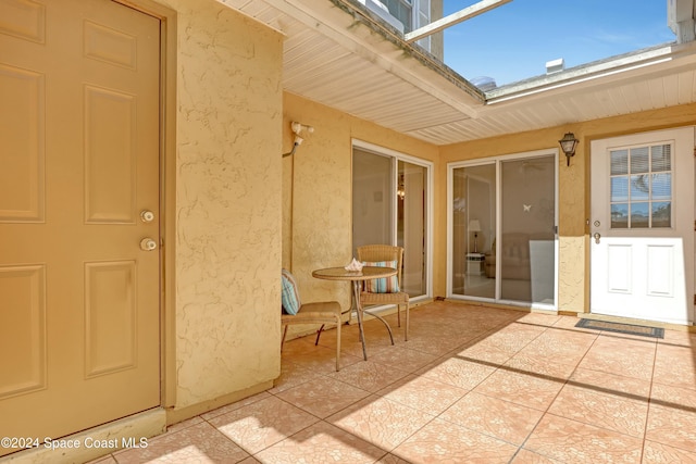 property entrance featuring a patio area