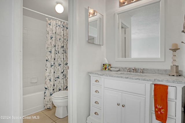 full bathroom featuring vanity, tile patterned floors, toilet, shower / bath combo with shower curtain, and a textured ceiling