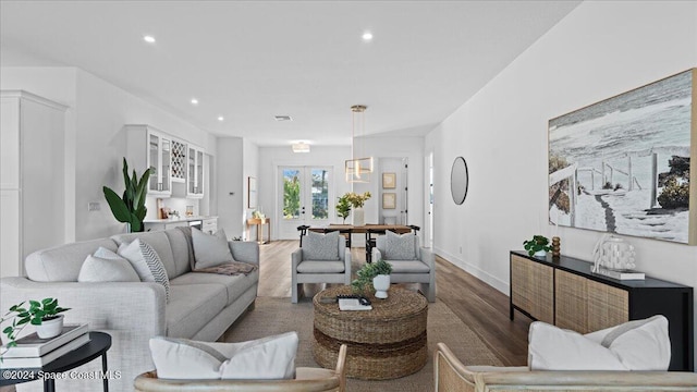 living area featuring french doors, wood finished floors, visible vents, and recessed lighting