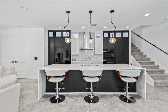 kitchen with sink, wall chimney exhaust hood, backsplash, built in refrigerator, and decorative light fixtures