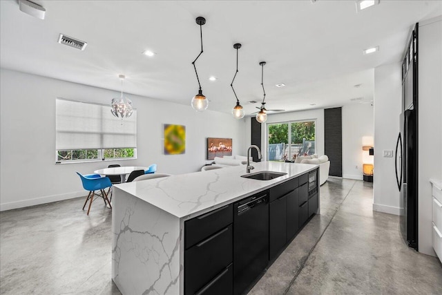 kitchen featuring a large island, sink, hanging light fixtures, black dishwasher, and fridge