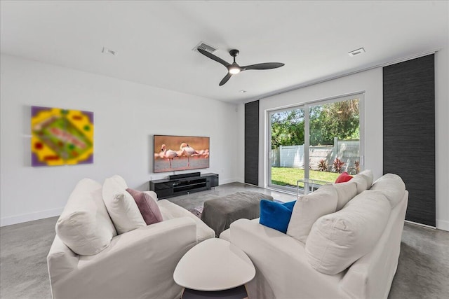 living room with concrete floors and ceiling fan