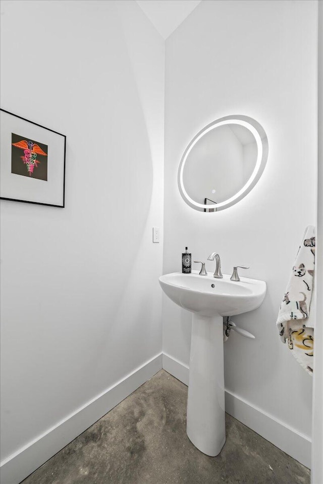 bathroom with concrete flooring