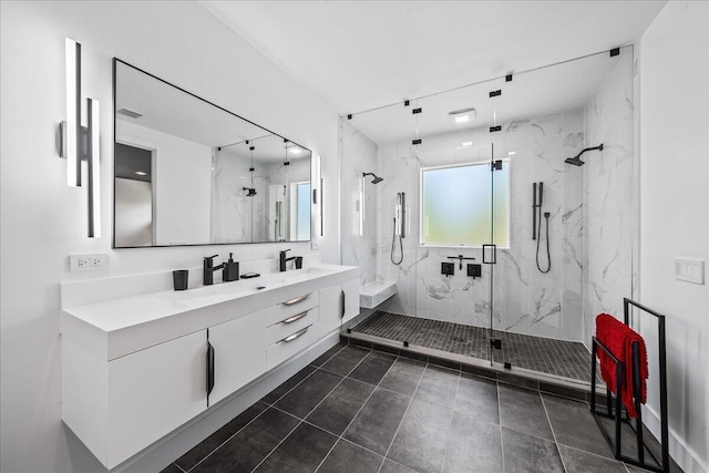 bathroom featuring tile patterned floors, vanity, and an enclosed shower