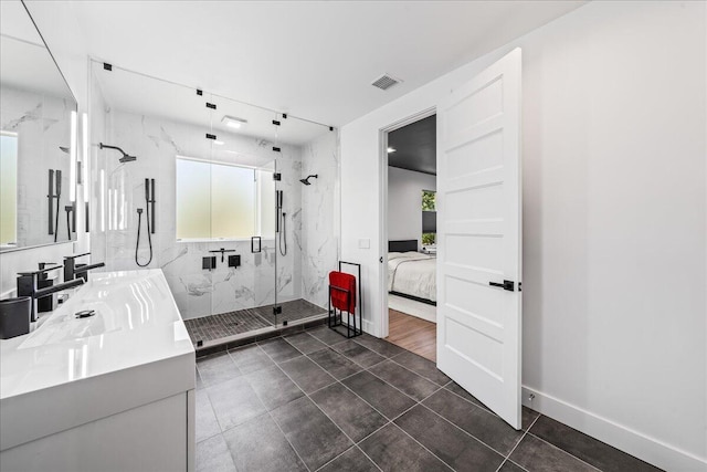 bathroom with tile patterned flooring, vanity, and an enclosed shower