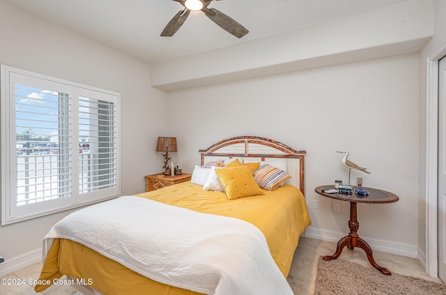 bedroom with light colored carpet and ceiling fan