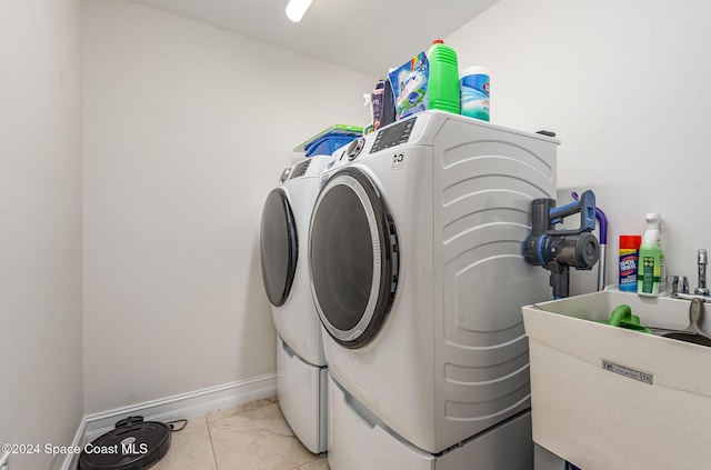 laundry area featuring sink and washer and dryer