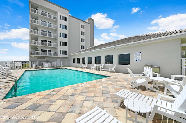 view of swimming pool with a patio area