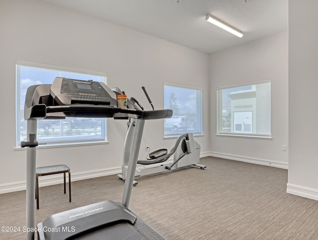 exercise room with carpet floors