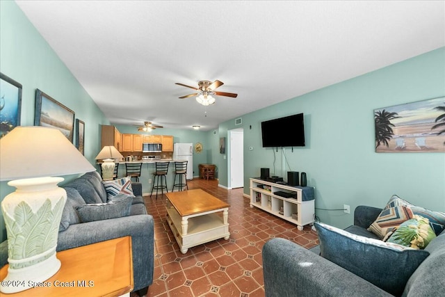 22 Tulip Ave Unit 309, Cocoa Beach, FL 32931 - living area featuring ceiling fan