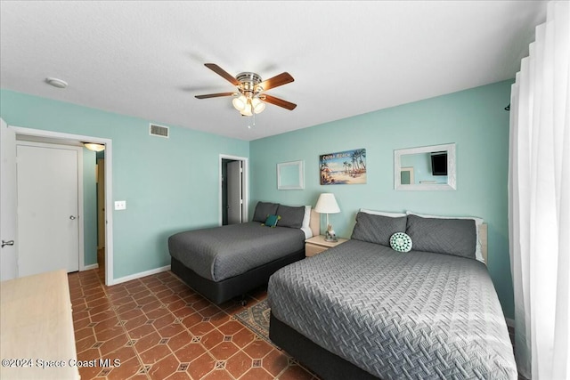 22 Tulip Ave Unit 309, Cocoa Beach, FL 32931 - bedroom with ceiling fan and baseboards