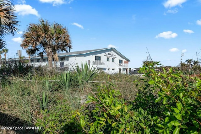 22 Tulip Ave Unit 309, Cocoa Beach, FL 32931 - back of house with a balcony