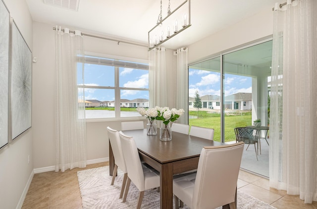 tiled dining space with a wealth of natural light