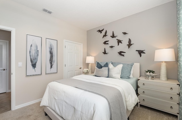 bedroom featuring light colored carpet