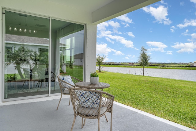 view of patio featuring a water view