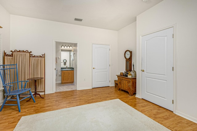 sitting room featuring wood-type flooring