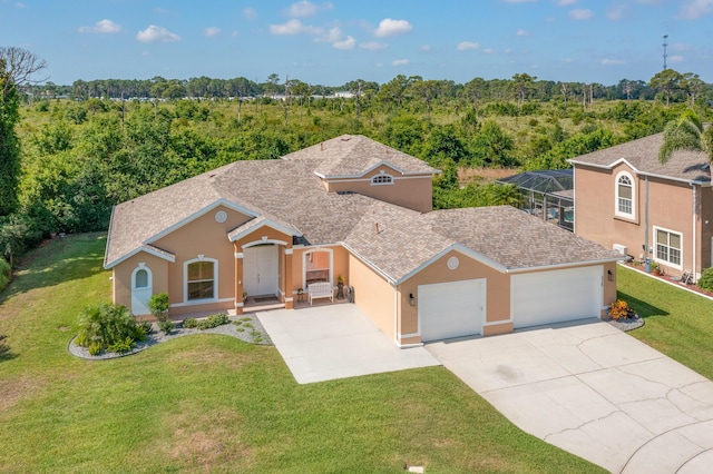 view of front of property with a garage, a front lawn, and a lanai