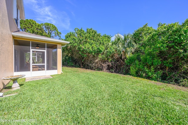 view of yard with a sunroom