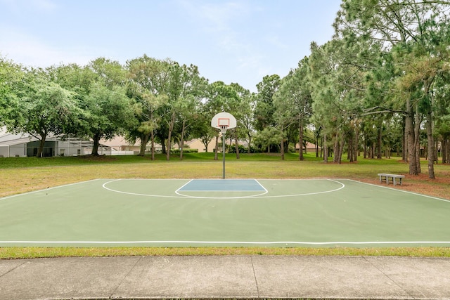 view of basketball court featuring a lawn