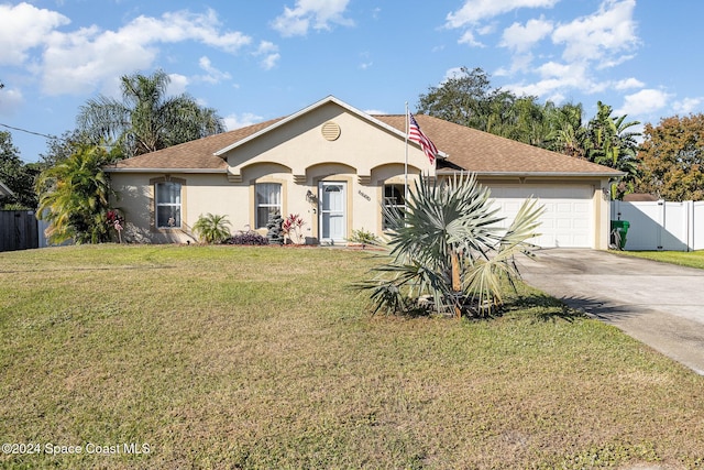 view of front facade with a garage and a front lawn