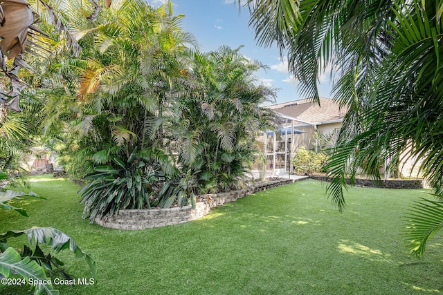 view of yard with a lanai