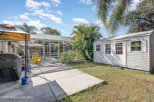 exterior space with an outdoor structure, a lanai, a swimming pool, a gazebo, and a patio