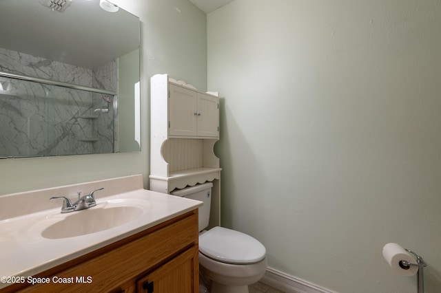 bathroom featuring walk in shower, vanity, and toilet