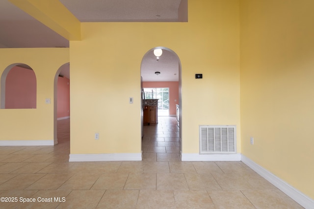 empty room featuring light tile patterned floors