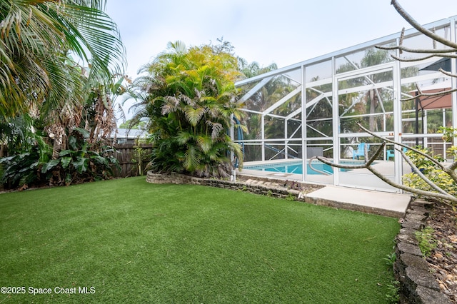 view of yard with a lanai