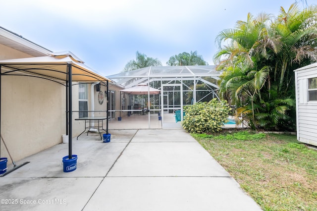 view of patio / terrace with a lanai