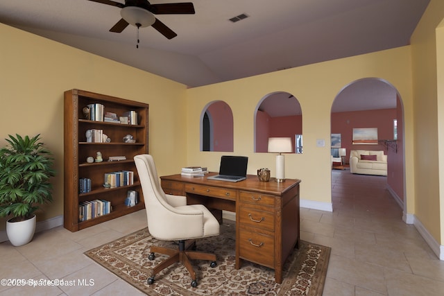 office space with lofted ceiling, light tile patterned floors, and ceiling fan