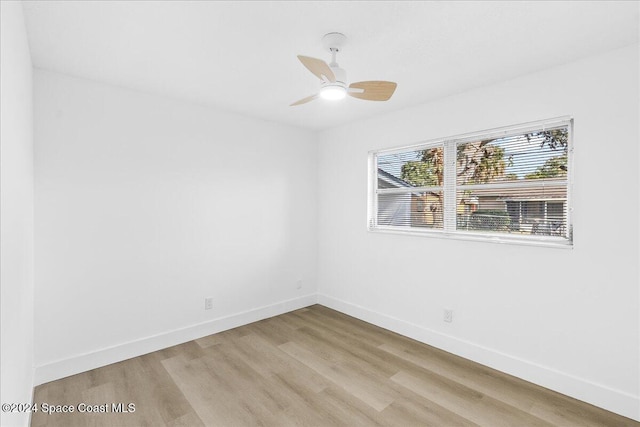 spare room with light hardwood / wood-style flooring and ceiling fan