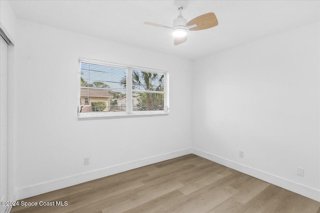 unfurnished room featuring light hardwood / wood-style floors and ceiling fan