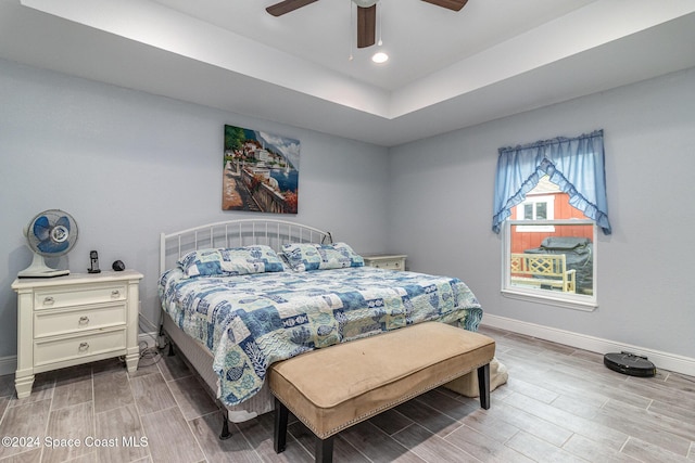 bedroom featuring hardwood / wood-style flooring and ceiling fan